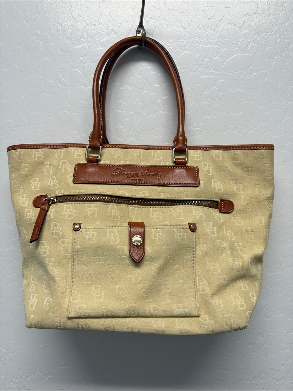 Dooney & Bourke Beige Canvas Tote with Brown Leather Trim and Front Pocket
